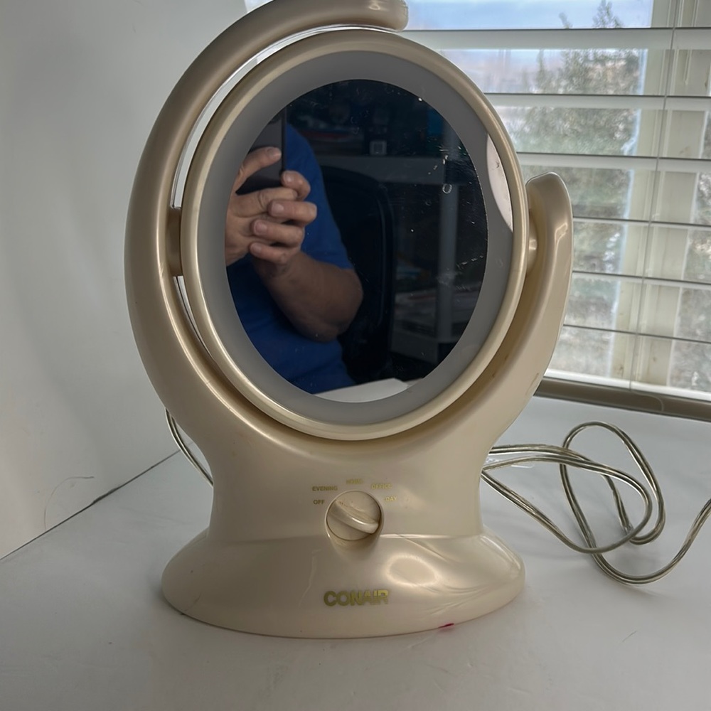 Go air make-up mirror regular and magnifying.